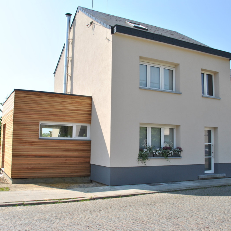 ISOLATION PAR L'EXTÉRIEURE D'UNE HABITATION AVEC EXTENSIONS